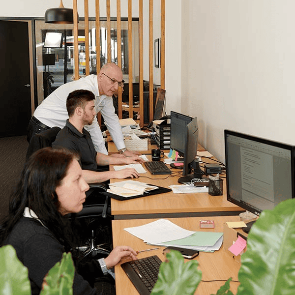 Office team working on SEO strategies at computers for PracticeEdge.