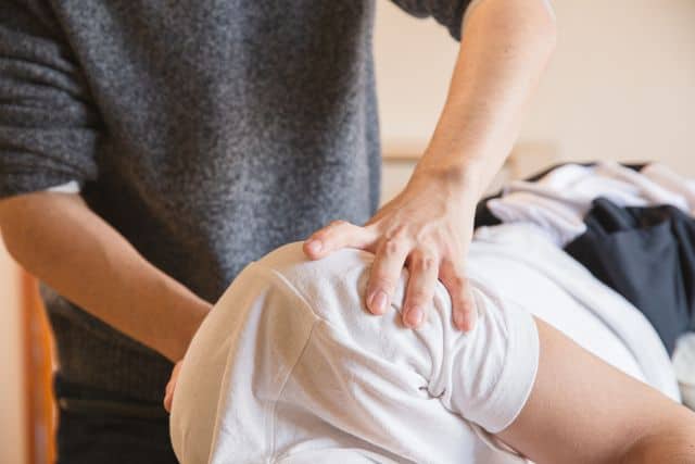 Chiropractic adjustment in progress.